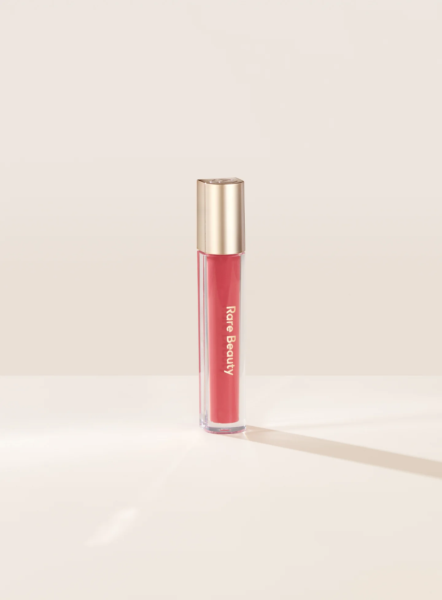 RARE BEAUTY STAY VULNERABLE GLOSSY LIP BALM - NEARLY APRICOT