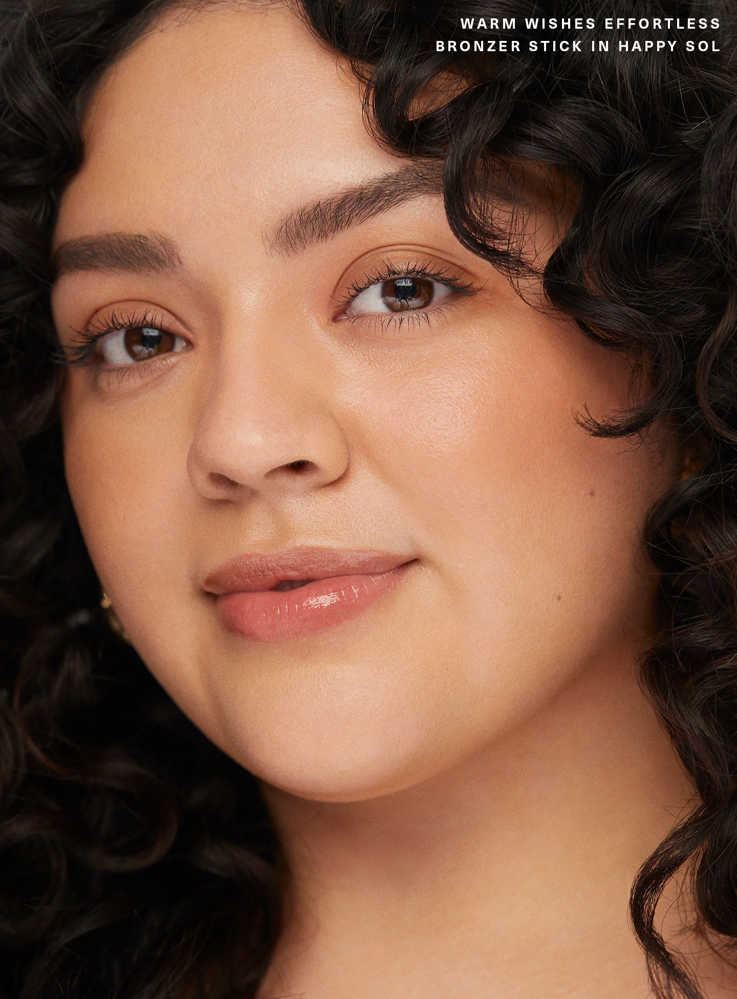 RARE BEAUTY WARM WISHES EFFORTLESS BRONZER STICK - HAPPY SOL